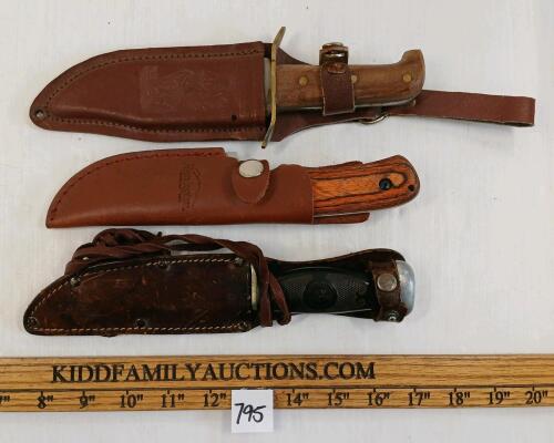 LOT OF 3 - REMINGTON & PAKISTAN KNIVED W/ LEATHER SHEATHS